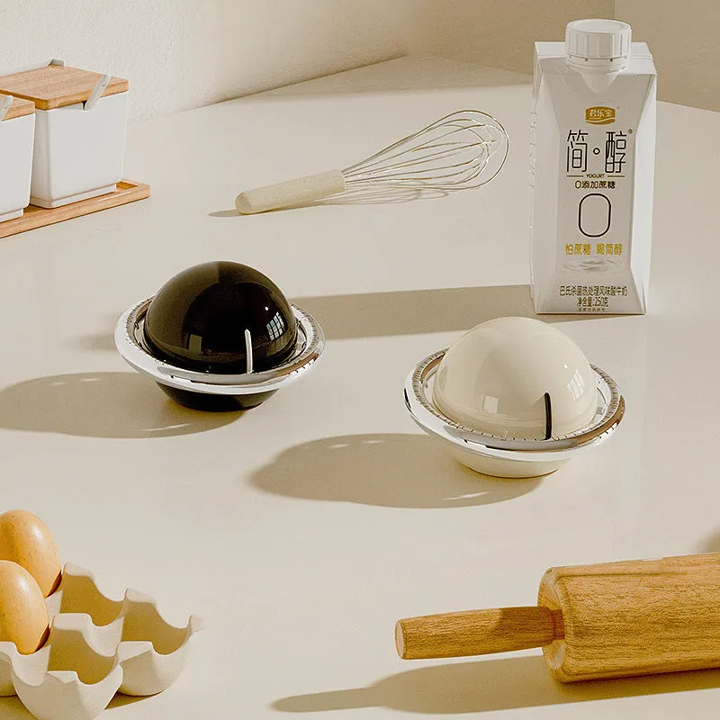 Beige mechanical kitchen timer with manual twist dial and countdown display on a kitchen countertop