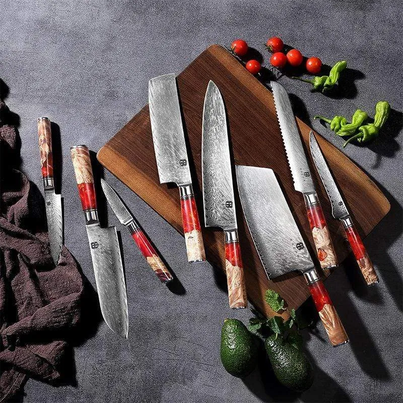 Damascus chef's knife with unique epoxy resin handle and Three German steel blade on cutting board