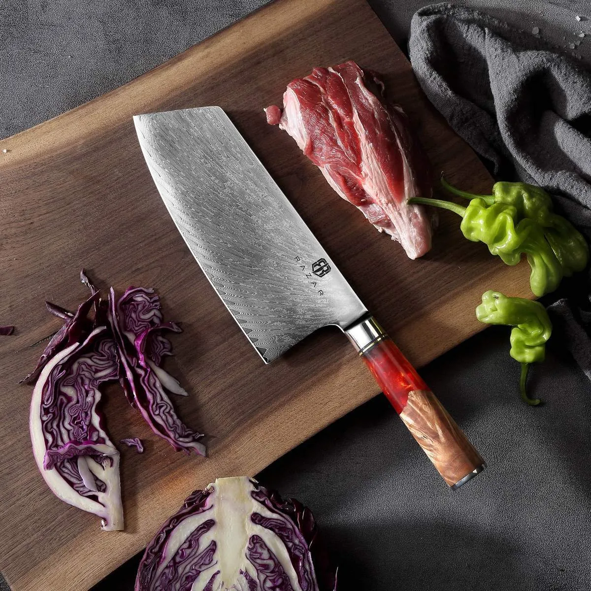 Damascus chef's knife with unique epoxy resin handle and Three German steel blade on cutting board