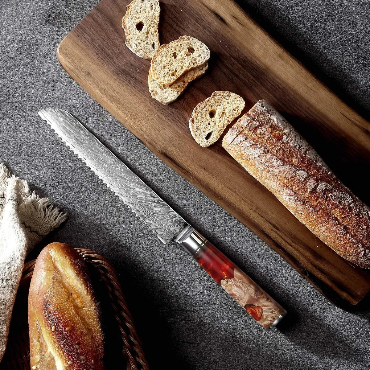 Damascus chef's knife with unique epoxy resin handle and Three German steel blade on cutting board