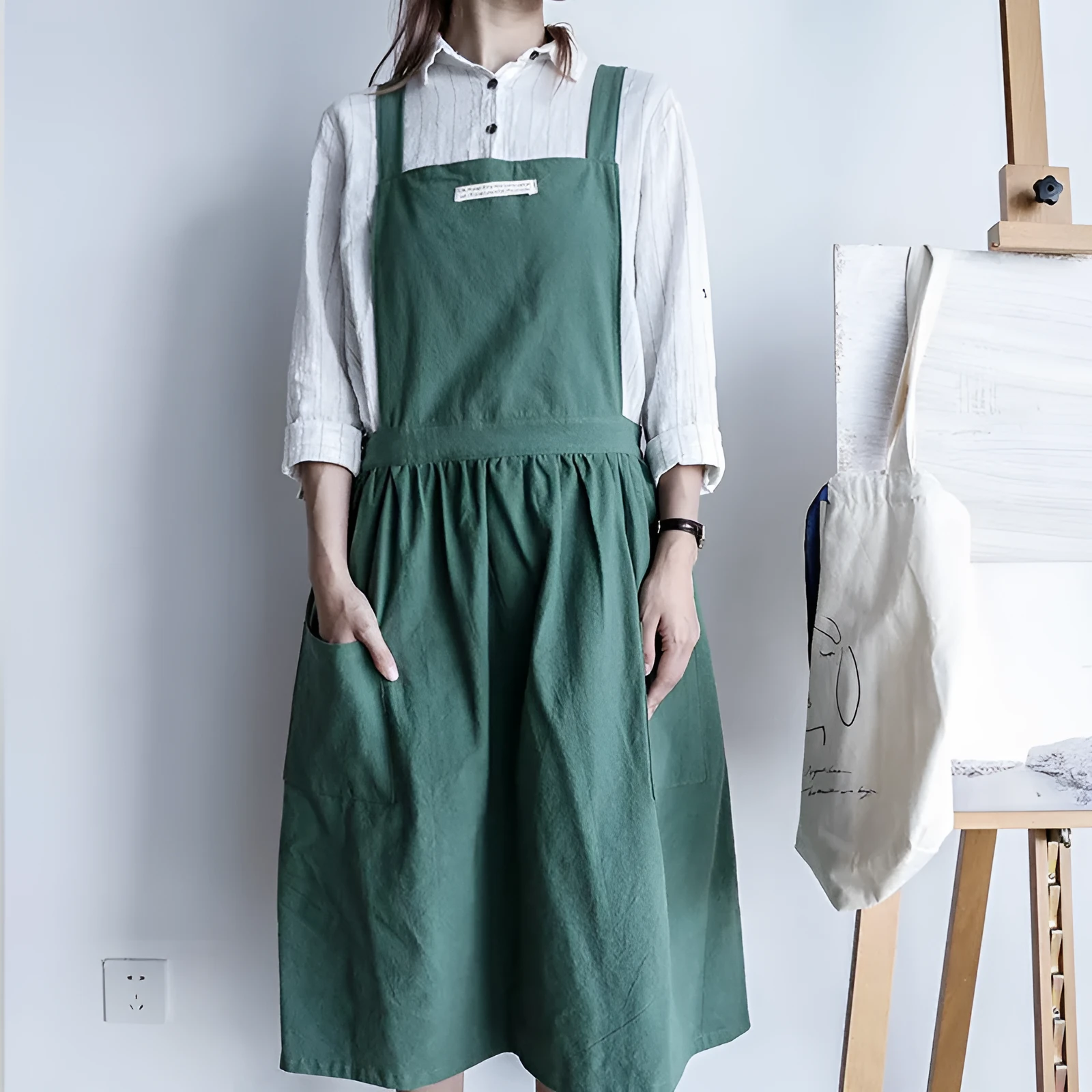 Cotton plain sleeveless kitchen apron in blue colour on white background