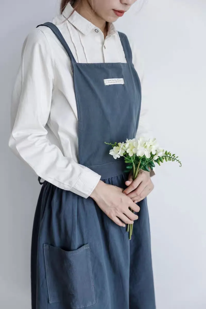 Cotton plain sleeveless kitchen apron in blue colour on white background