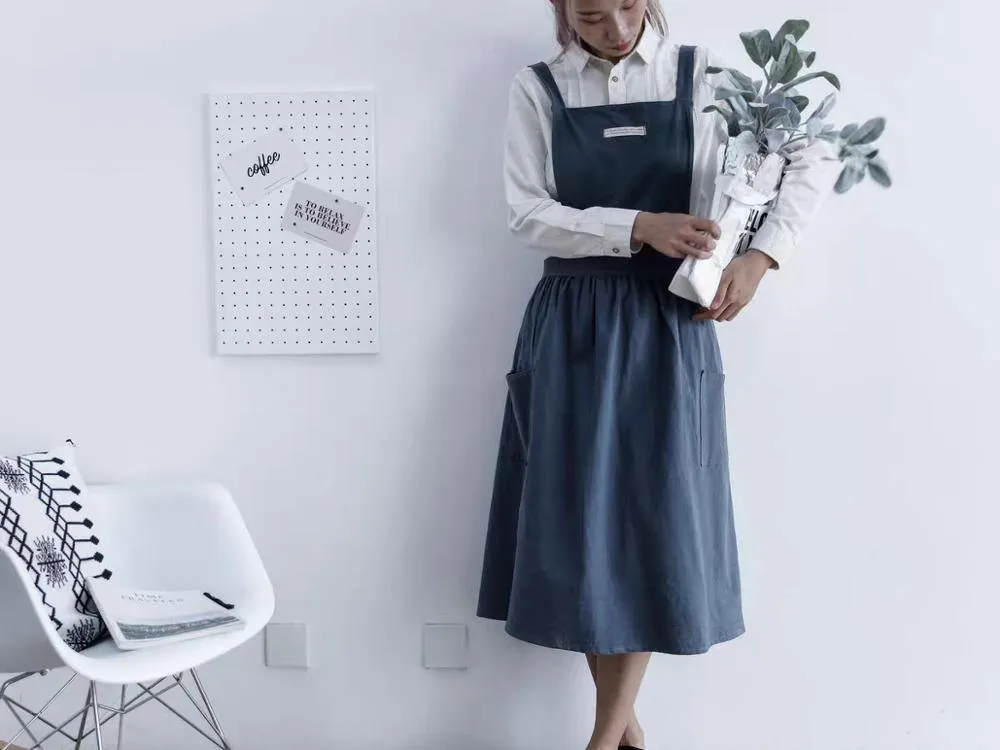 Cotton plain sleeveless kitchen apron in blue colour on white background