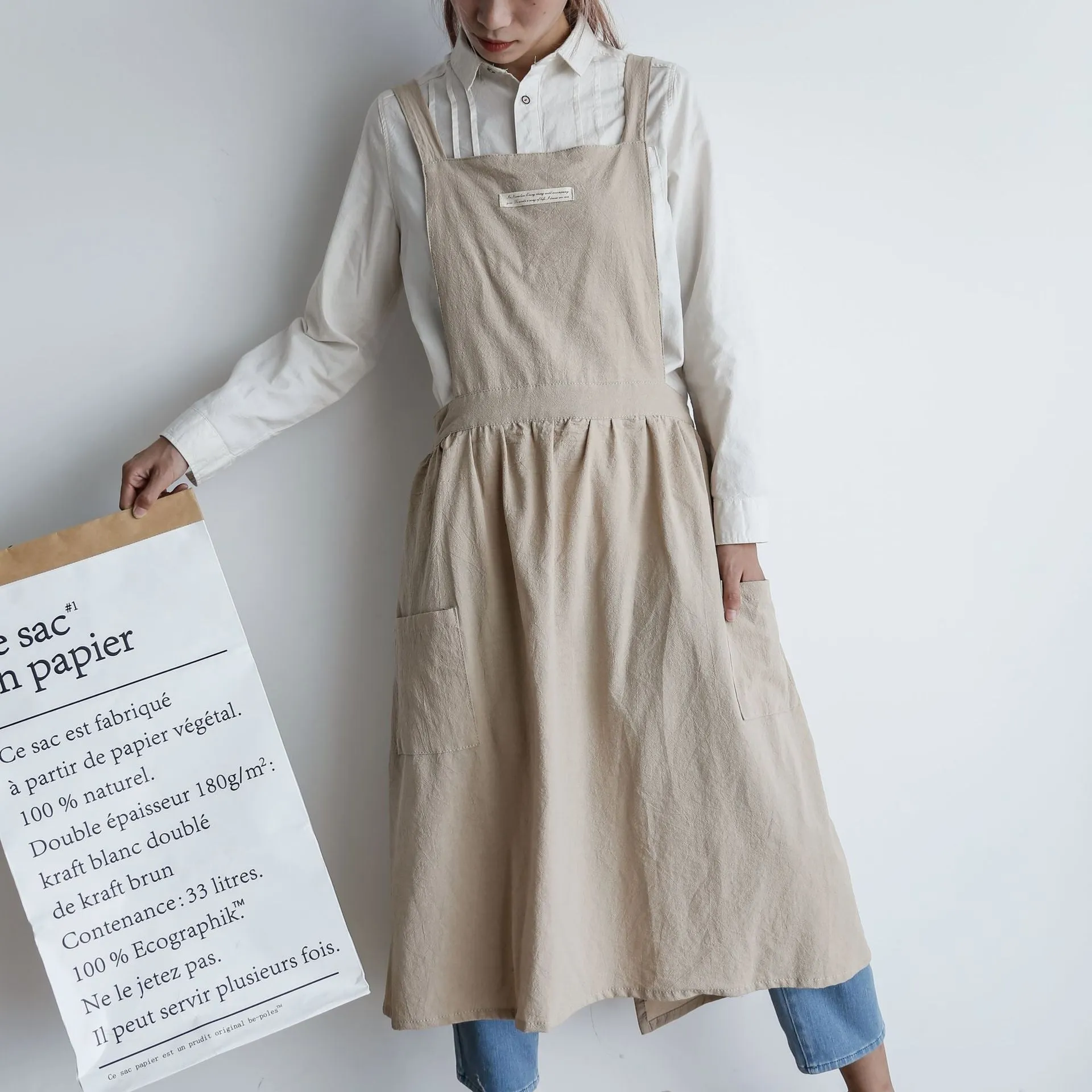 Cotton plain sleeveless kitchen apron in blue colour on white background