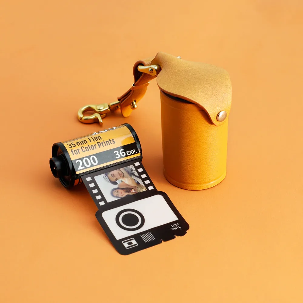 Yellow plastic custom photo keychain with film roll design featuring a personalised picture insert