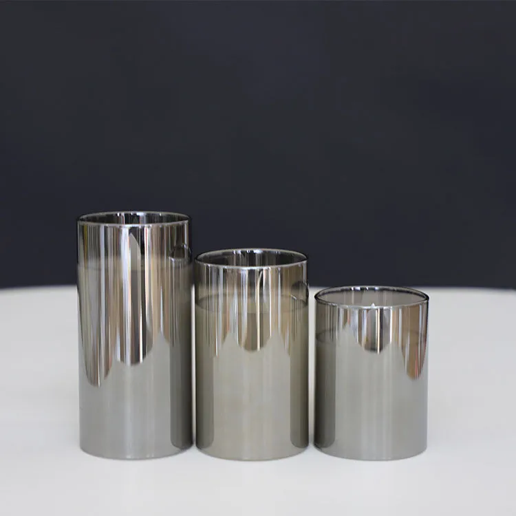 LED electronic remote control candle in cylindrical glass plating with warm yellow swinging flame