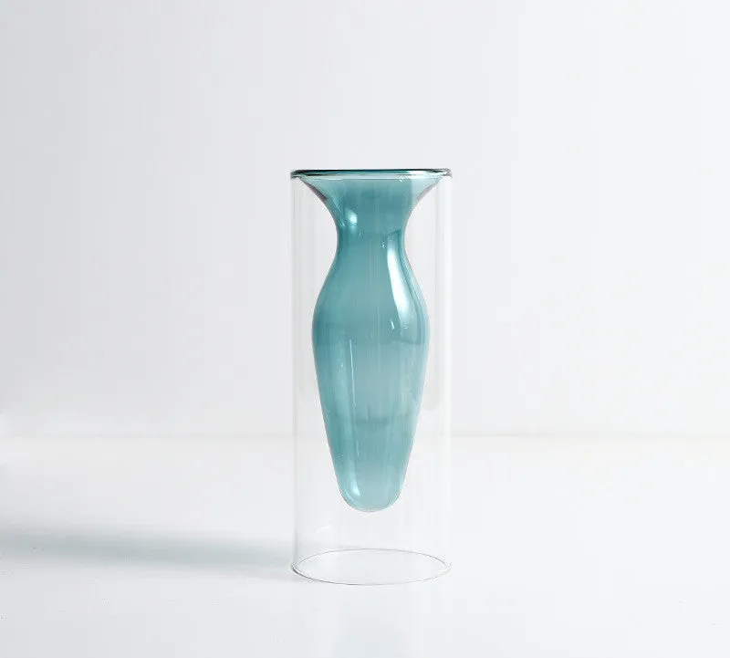 Small colourful double layer blown glass vase for dried flowers, yellow colour option on a table