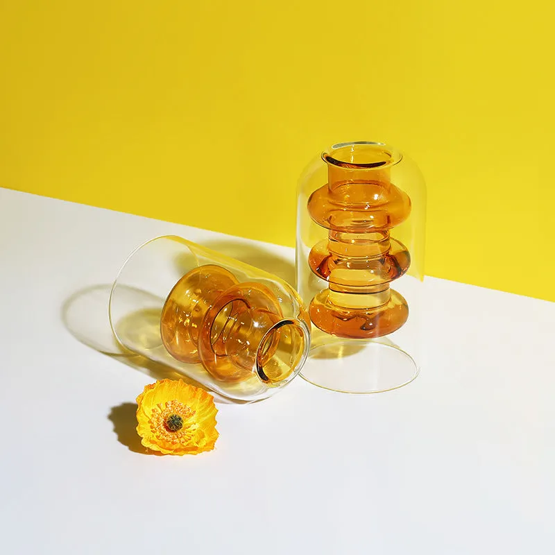 Small colourful double layer blown glass vase for dried flowers, yellow colour option on a table