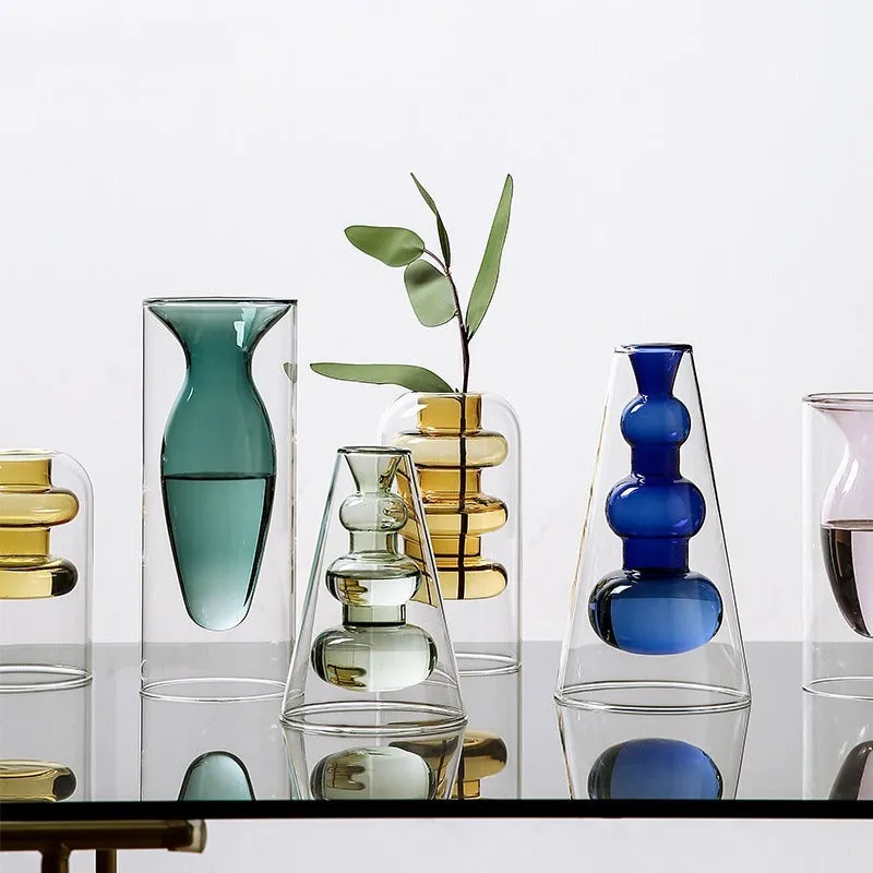 Small colourful double layer blown glass vase for dried flowers, yellow colour option on a table