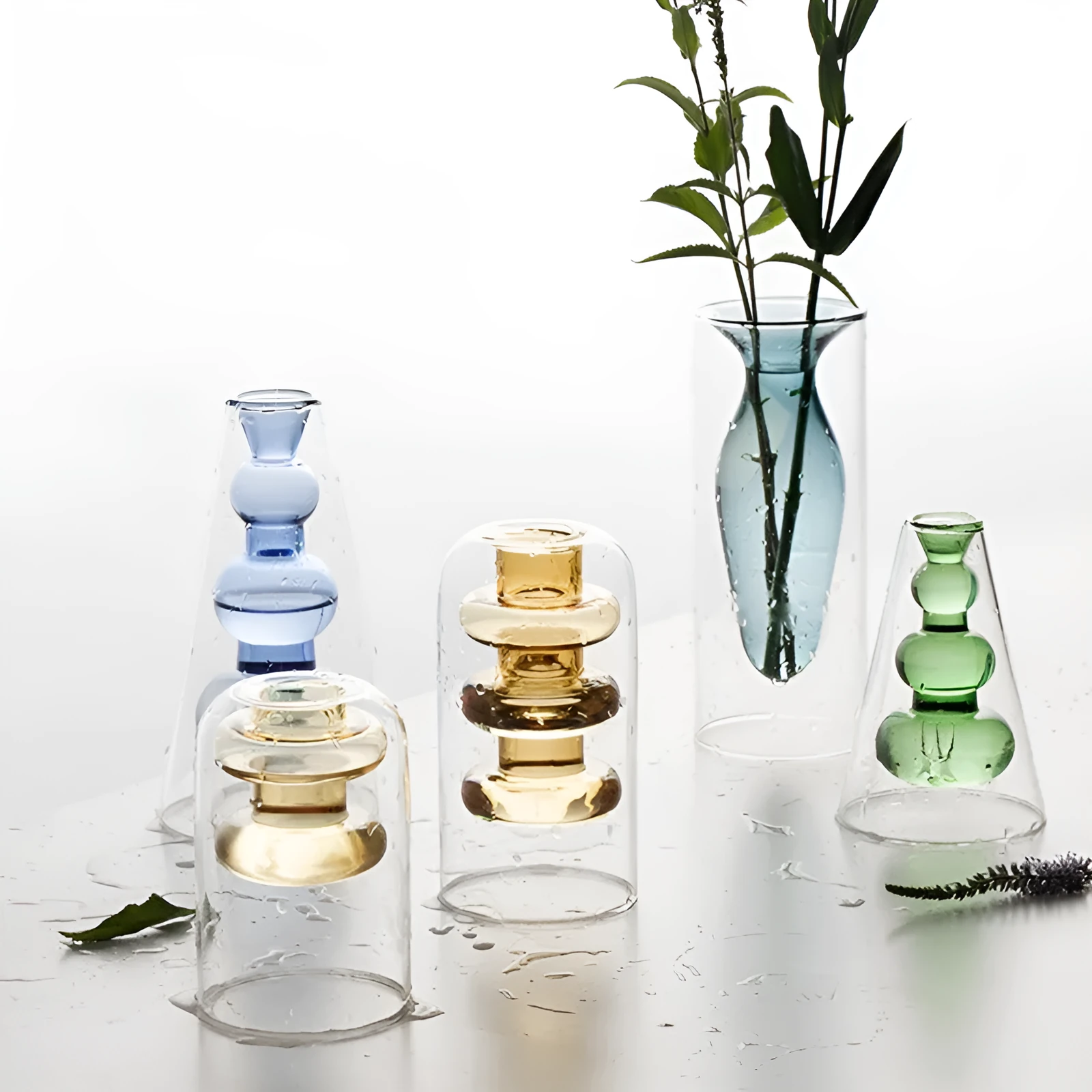 Small colourful double layer blown glass vase for dried flowers, yellow colour option on a table