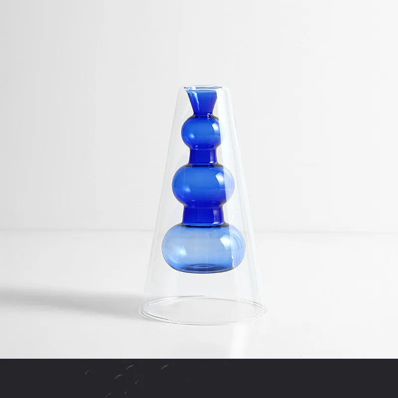 Small colourful double layer blown glass vase for dried flowers, yellow colour option on a table