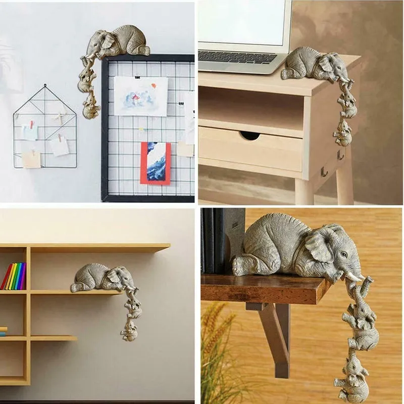 Resin mother elephant and baby elephant figurine set on display