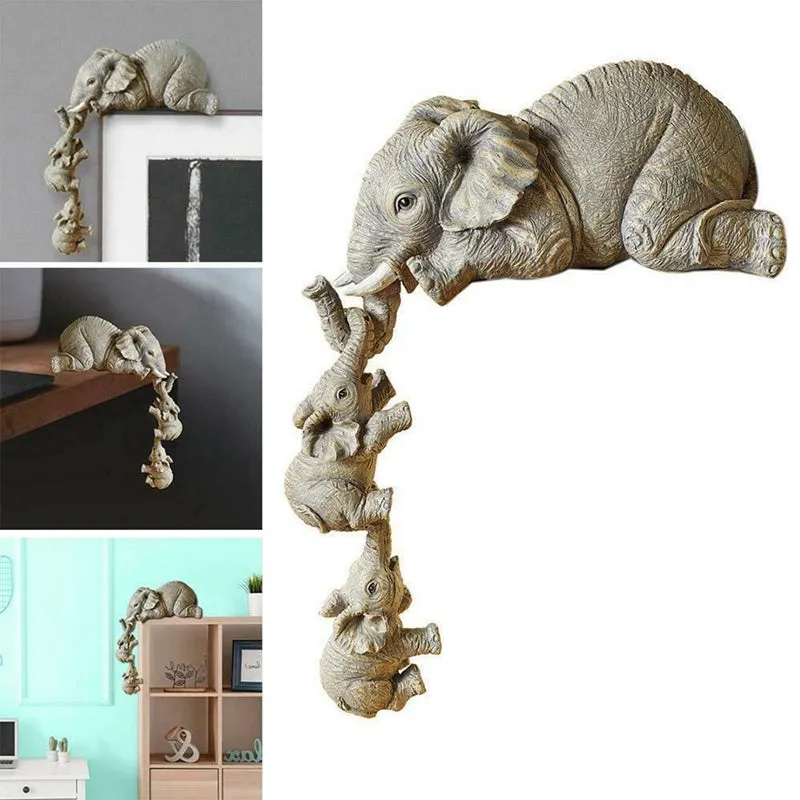 Resin mother elephant and baby elephant figurine set on display