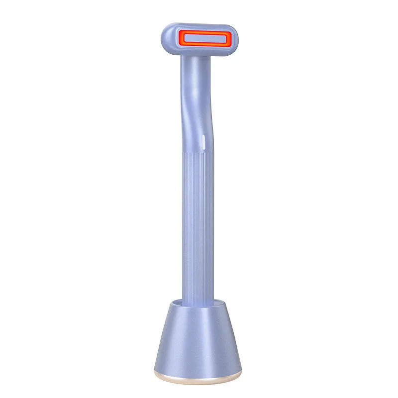 Purple rotary eye massage wand with red LED light and microcurrent on a white background