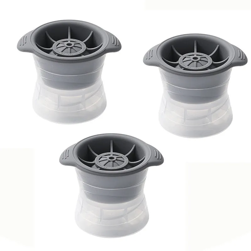 Gray silicone spherical ice ball mould with ABS lid on a kitchen countertop