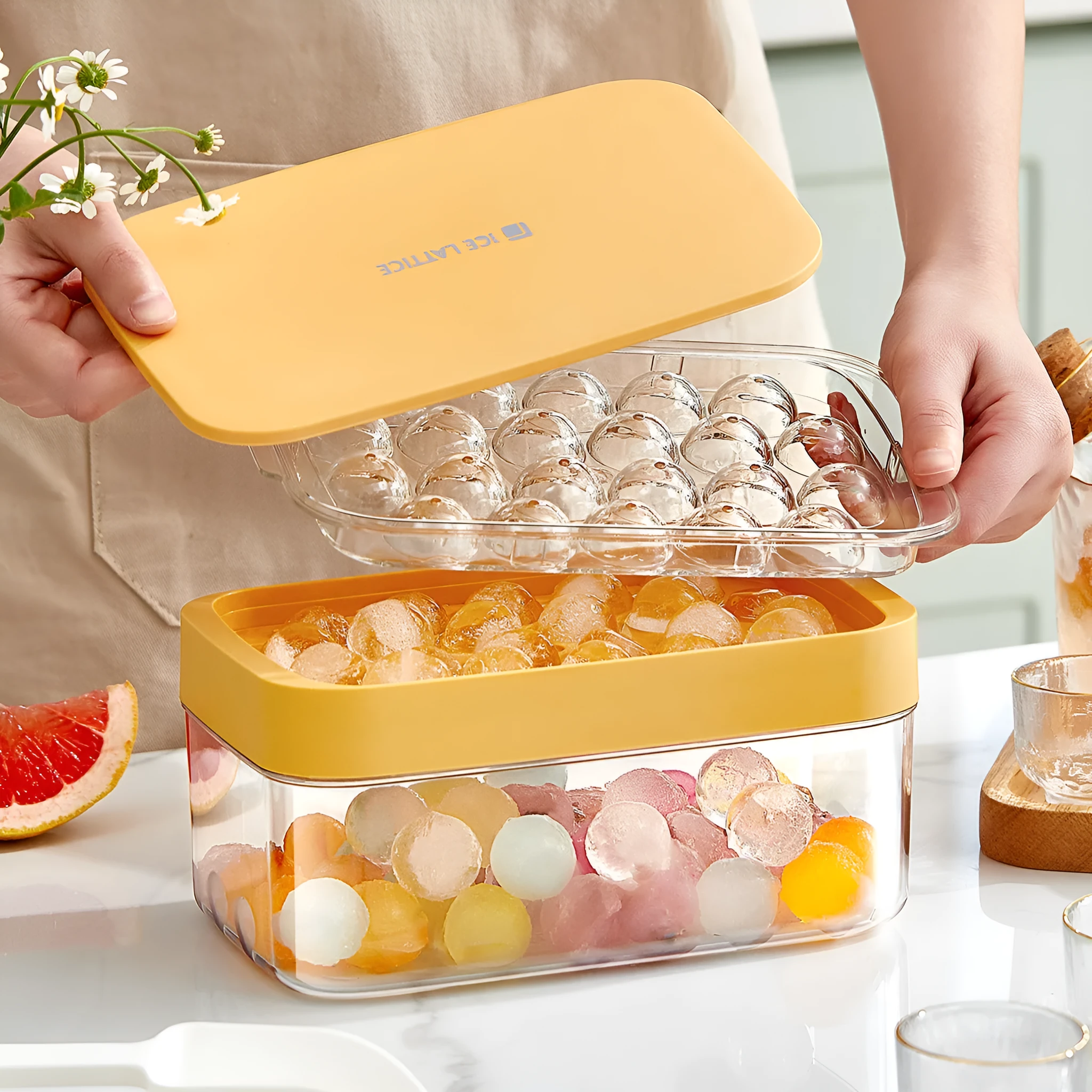 Silicone ball ice hockey mold in ivory white on a countertop, showing round cavity shapes for large ice cubes