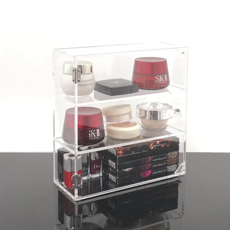 Clear acrylic cosmetics storage box 24x10x34cm on a vanity table holding makeup and skincare products