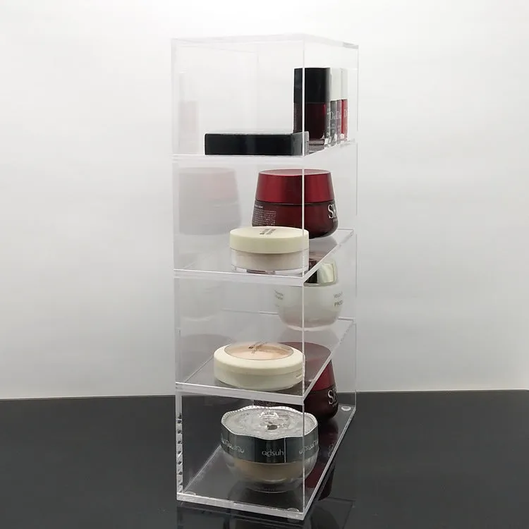 Clear acrylic cosmetics storage box 24x10x34cm on a vanity table holding makeup and skincare products