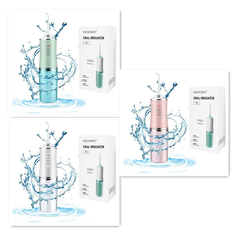 White portable oral irrigator with four nozzles and USB charging cable on a bathroom surface