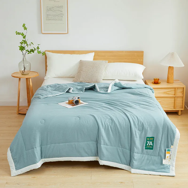 Antibacterial raw cotton washable summer cool quilt in Haze Blue colour, showing quilted pattern and fabric texture