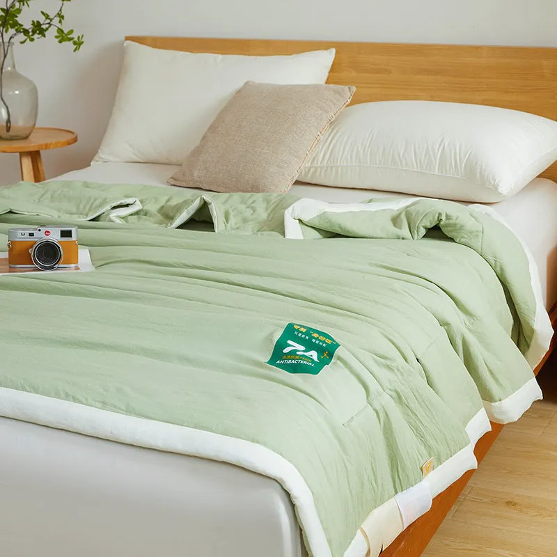Antibacterial raw cotton washable summer cool quilt in Haze Blue colour, showing quilted pattern and fabric texture