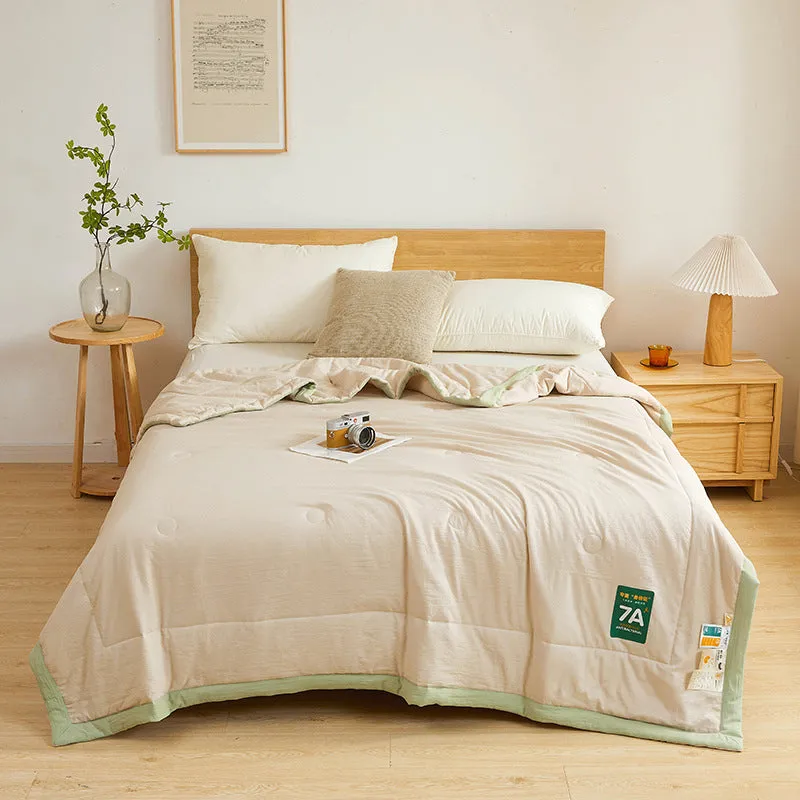 Antibacterial raw cotton washable summer cool quilt in Haze Blue colour, showing quilted pattern and fabric texture