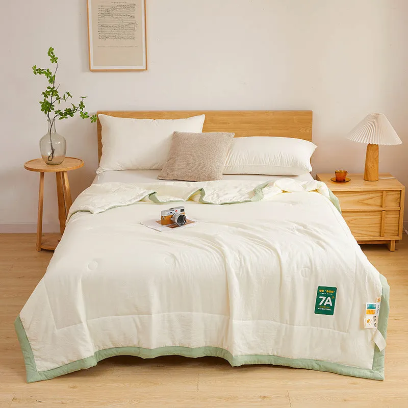 Antibacterial raw cotton washable summer cool quilt in Haze Blue colour, showing quilted pattern and fabric texture