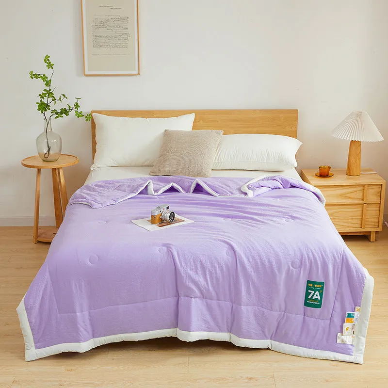 Antibacterial raw cotton washable summer cool quilt in Haze Blue colour, showing quilted pattern and fabric texture