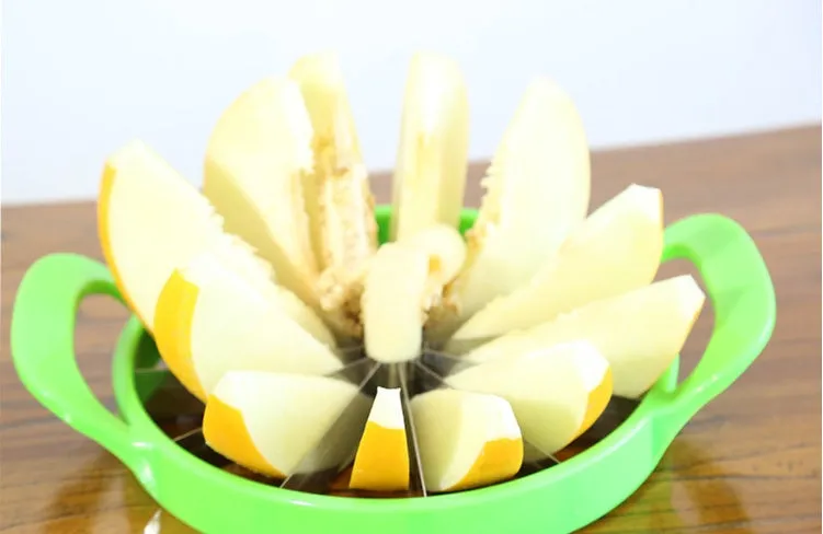 Green watermelon slicer with 410 stainless steel blade and non-slip plastic handle.