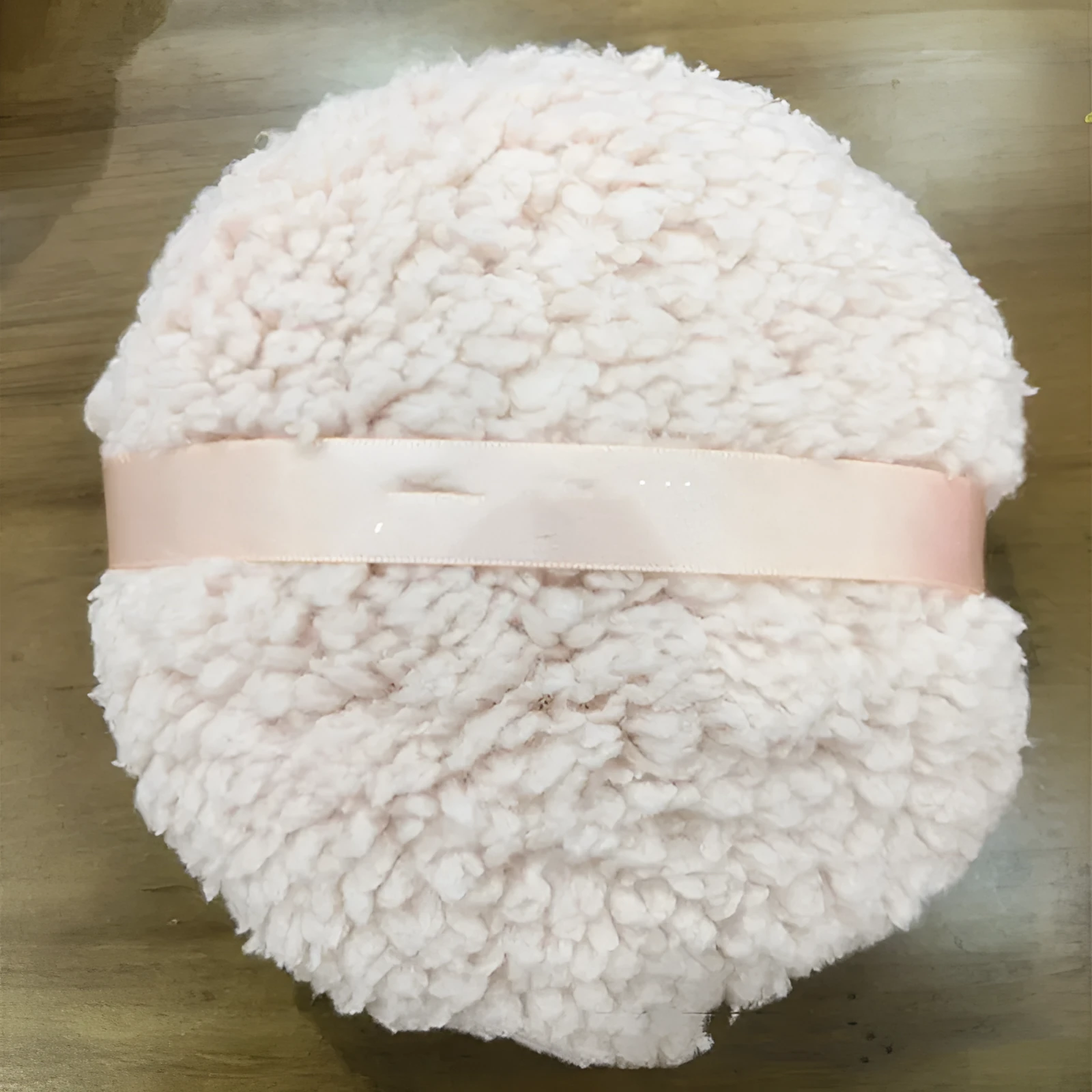 Oversized rectangular plush powder puff in white, skin colour, or pink for makeup application