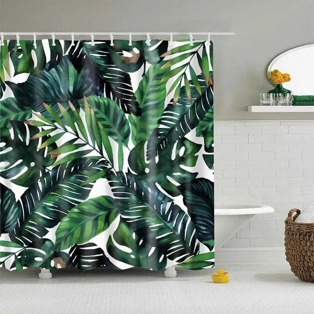 Tropical shower curtain with green foliage and white digital print on polyester, shown in a bathroom setting.