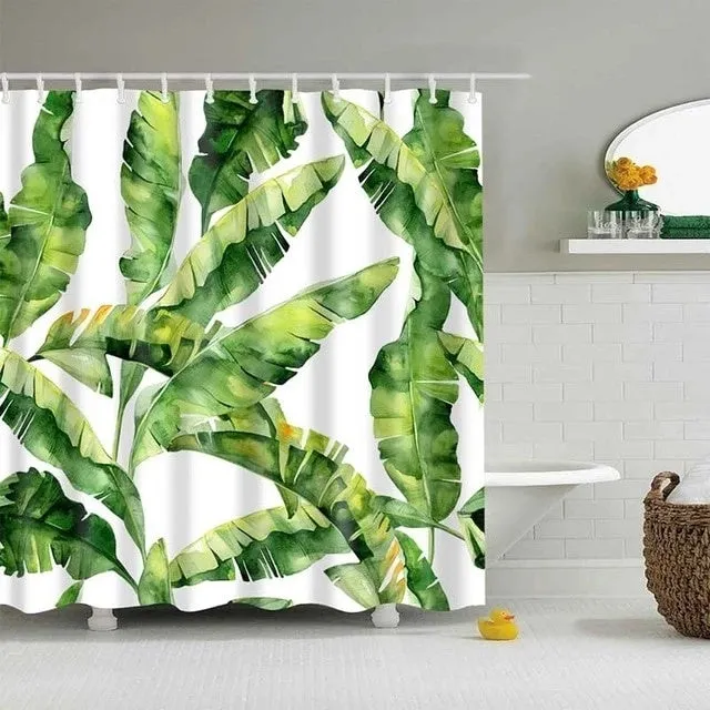 Tropical shower curtain with green foliage and white digital print on polyester, shown in a bathroom setting.