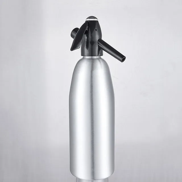 Silver portable 1L aluminium soda maker with pressure regulator and safe cover on table