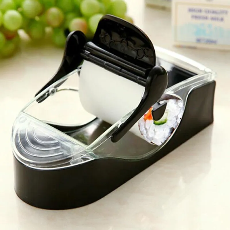 Black DIY plastic kitchen roll sushi machine on a flat surface with lever and roller band visible