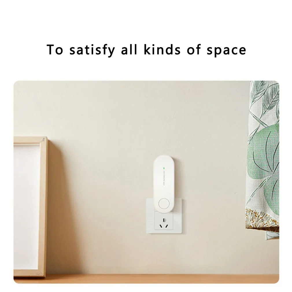 Small negative ion air purifier in black, plugged into a wall socket, with a room in the background
