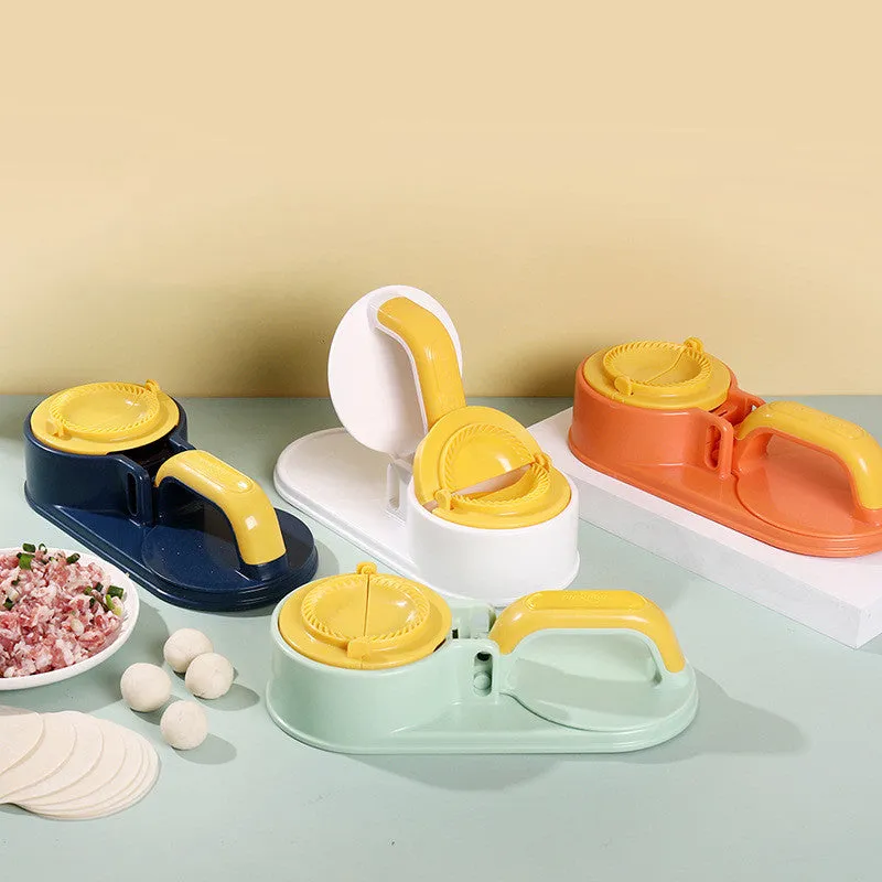 Plastic dumpling wrapper pressing device in fresh green colour on kitchen surface with dough