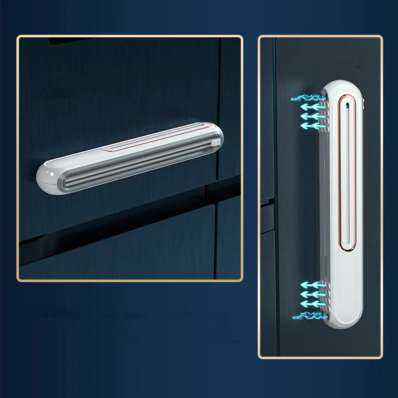 White and blue magnetic cling film cutter hanging on a fridge with a film roll
