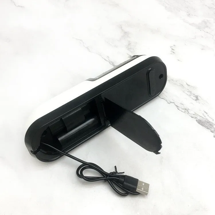 Rechargeable electric knife sharpener with ABS body and stainless steel components on a kitchen counter