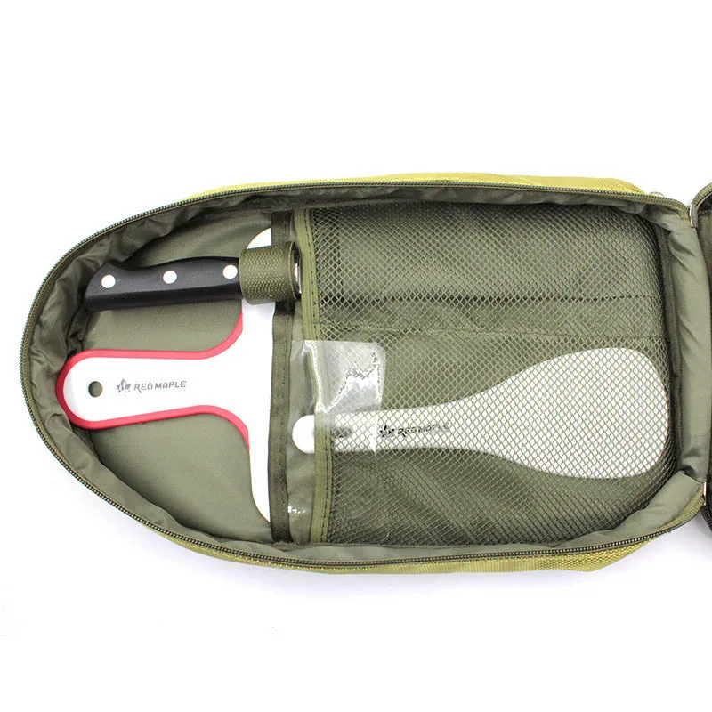 Camp kitchen cooking utensil set 8 pieces stainless steel with oxford storage bag on green background