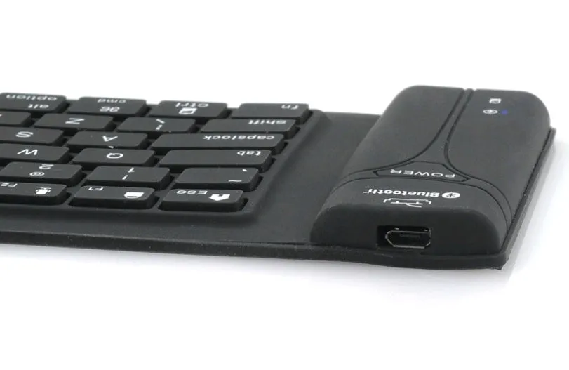 Black Bluetooth folding silicone keyboard with 108 keys and IP67 waterproof rating placed on a desk