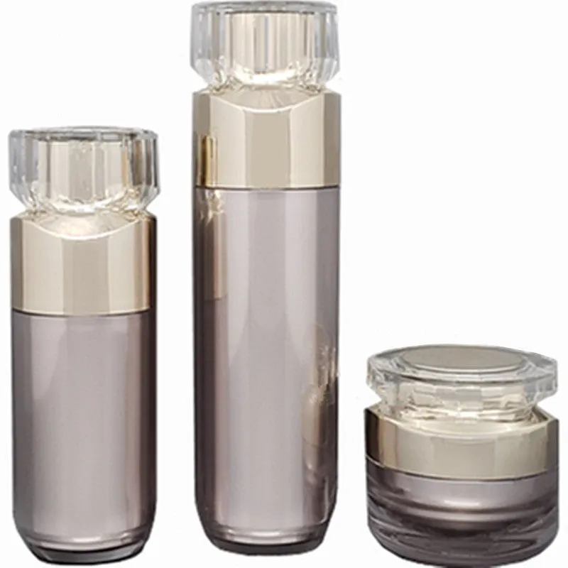 Acrylic cosmetics sub-bottling box with champagne gold and brushed white empty bottles in various sizes