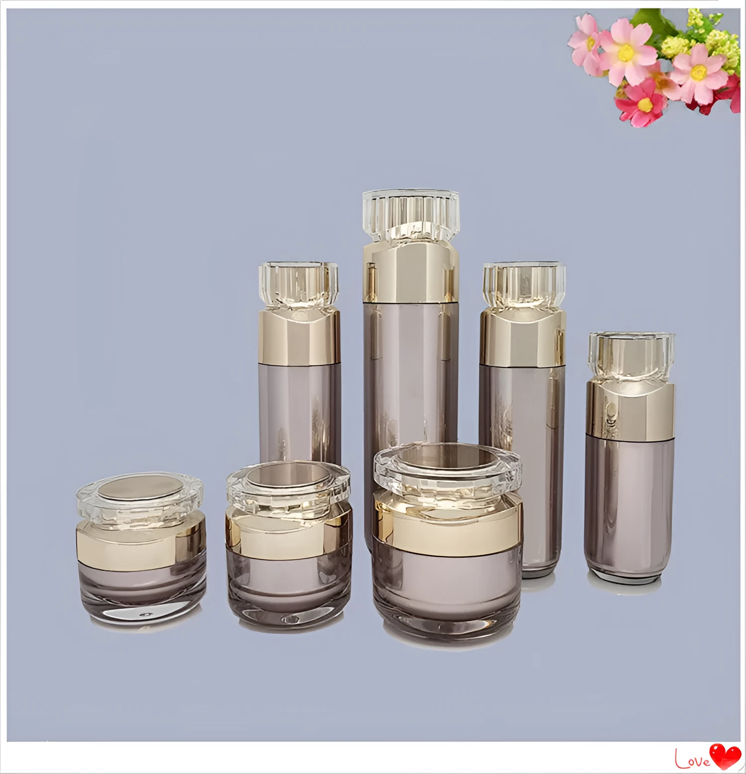 Acrylic cosmetics sub-bottling box with champagne gold and brushed white empty bottles in various sizes