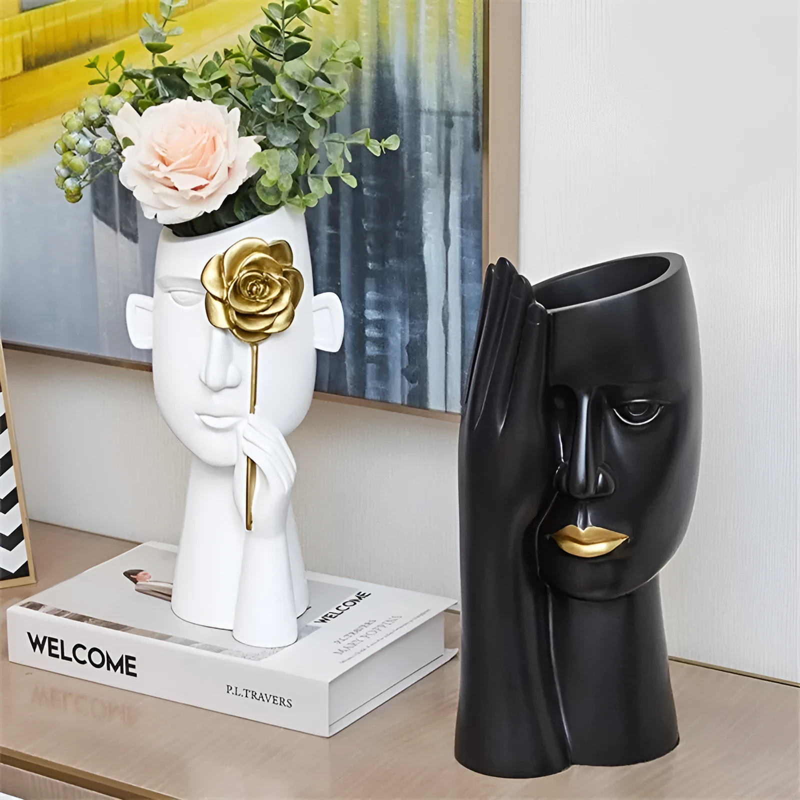 Modern black and white resin vase with sculpted body shape on living room table