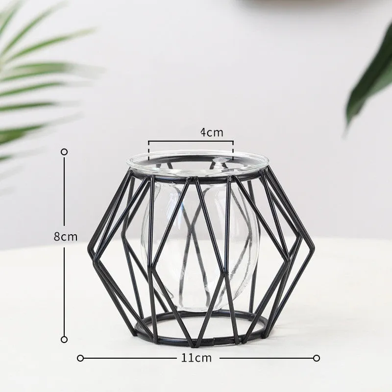 Nordic glass and iron desktop decoration in diamond gold shape on a wooden surface