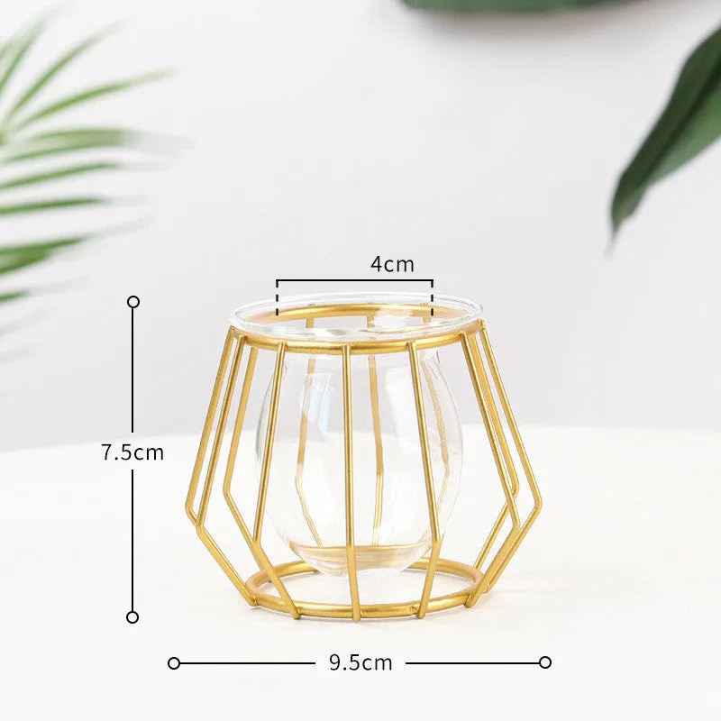 Nordic glass and iron desktop decoration in diamond gold shape on a wooden surface