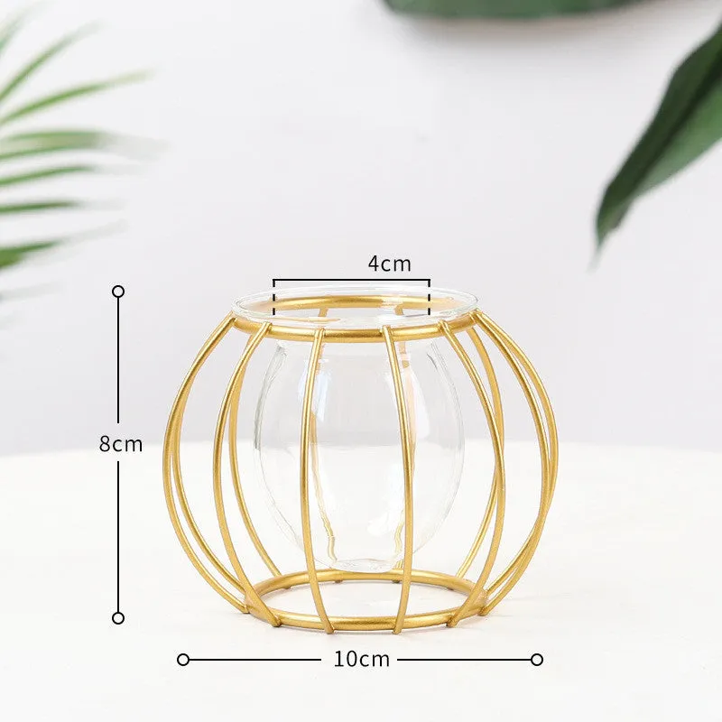 Nordic glass and iron desktop decoration in diamond gold shape on a wooden surface