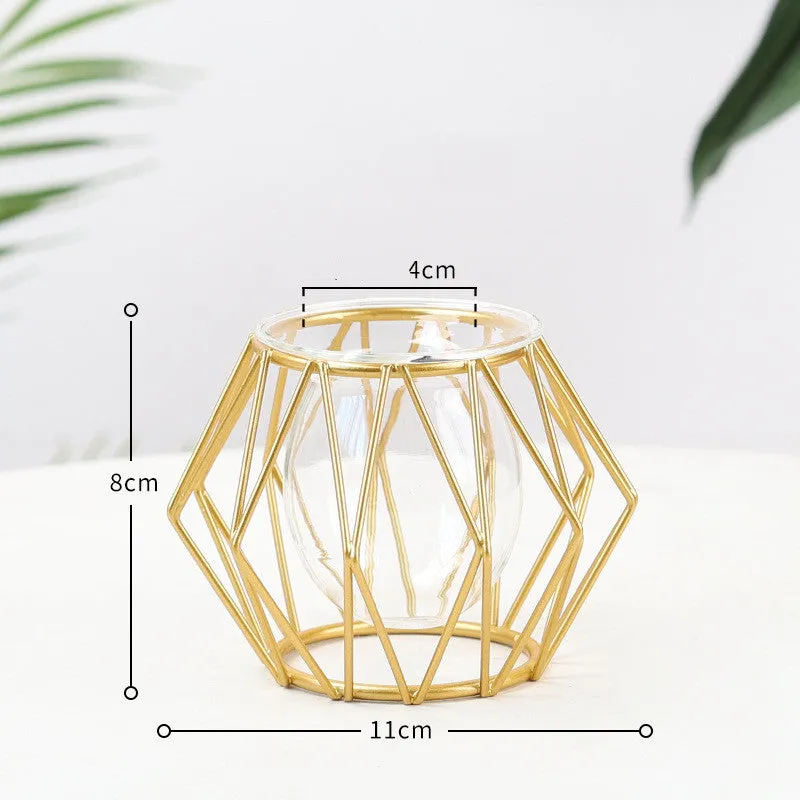 Nordic glass and iron desktop decoration in diamond gold shape on a wooden surface
