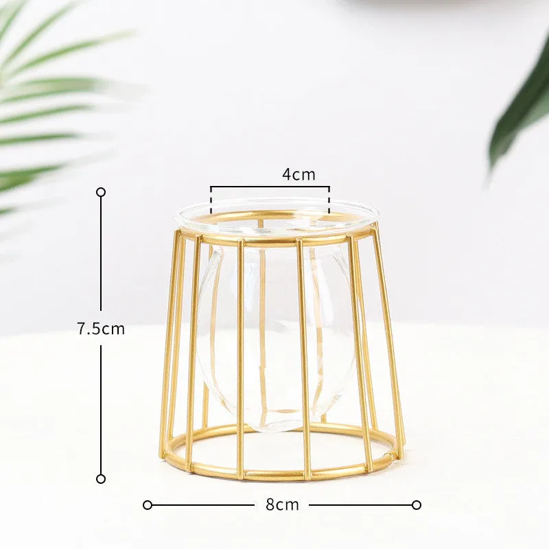 Nordic glass and iron desktop decoration in diamond gold shape on a wooden surface
