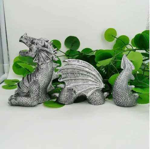 Large gothic dragon garden statue in charcoal grey resin with wings and tail, placed on a lawn
