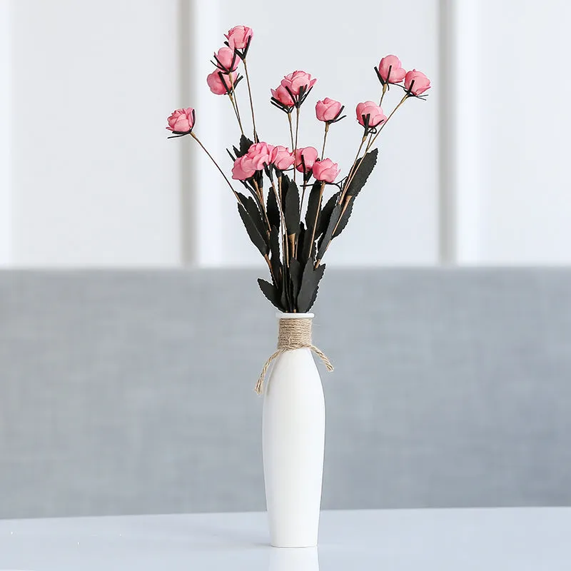 Modern simple ceramic vase with artificial dried flower arrangement on a countertop, medium size